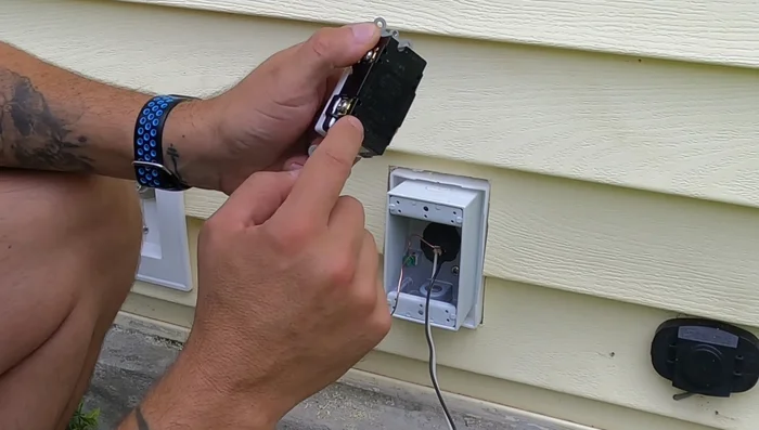 Connect the wires to the GFCI receptacle (line and load sides). Black wire goes to the brass terminal, white to the silver terminal, and green/bare copper to the ground screw. 