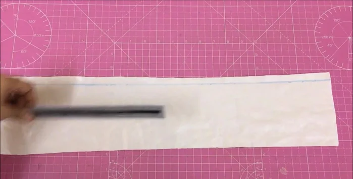 Cut 1/2 inch strips horizontally from the contrasting fabric (7 pieces).