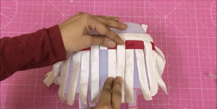 Tuck extra fabric inside the basket and secure.