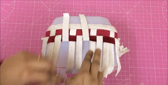 Tuck extra fabric inside the basket and secure.