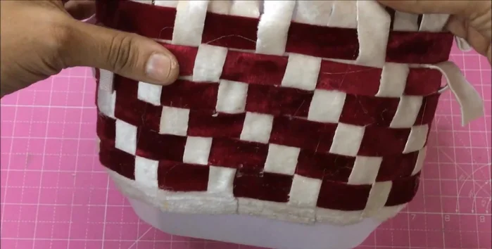 Tuck extra fabric inside the basket and secure.