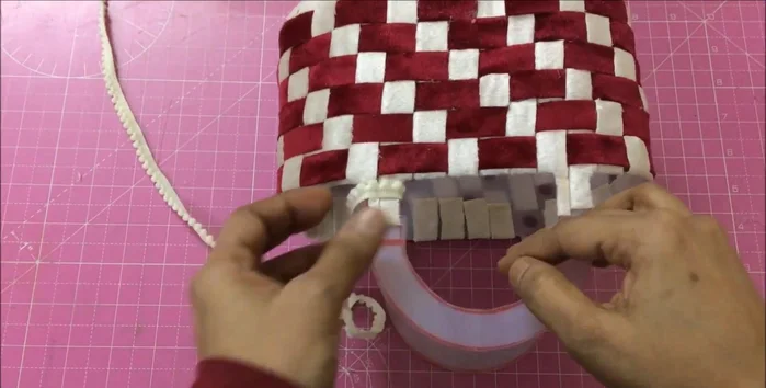 Measure the basket's volume. Use a fabric shopping bag of similar size, cutting it to fit above the basket's top. Glue the edges and insert into the basket, gluing the ends.