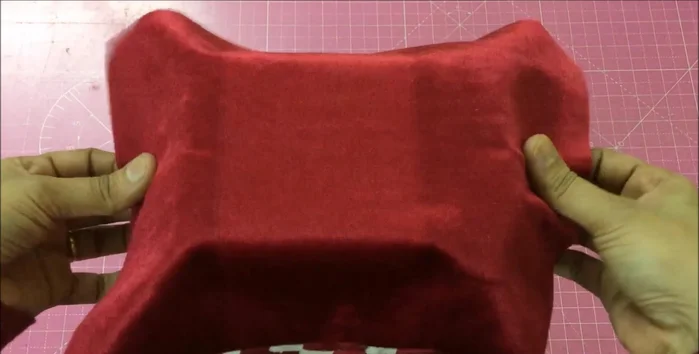 Measure the basket's volume. Use a fabric shopping bag of similar size, cutting it to fit above the basket's top. Glue the edges and insert into the basket, gluing the ends.