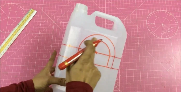 Measure the gallon's circumference (22 inches) and depth (3.5 inches + 1.5 inches extra).