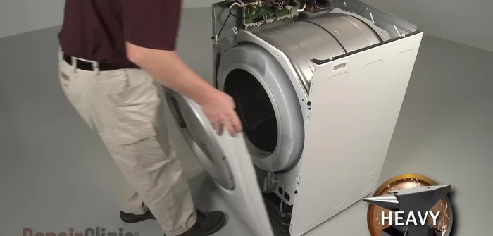 Remove the screws securing the duct housing to the blower assembly. Lift the front bulkhead up and pull it forward to remove.