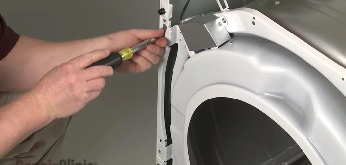 Remove the screws securing the duct housing to the blower assembly. Lift the front bulkhead up and pull it forward to remove.