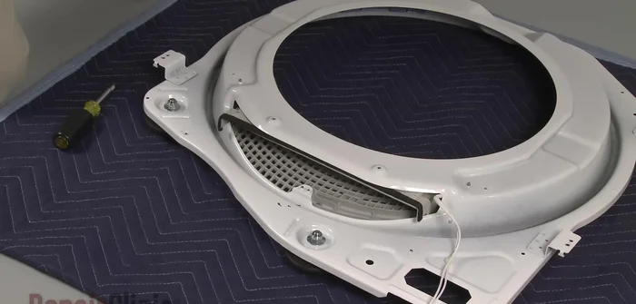 Access and remove the nuts securing the roller shaft, replace the roller, and then reposition the duct, securing it with screws and replacing the lint filter.