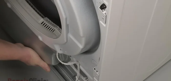 Reconnect the moisture sensor wire harness and light switch wire harness. Replace the front panel and secure it with screws.