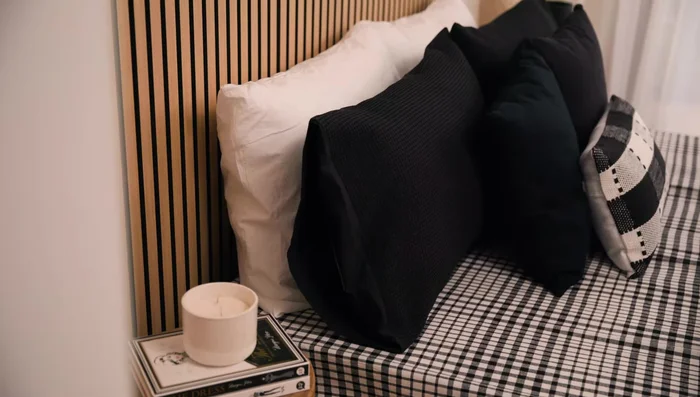 Style the room with lighting, artwork, and furniture.