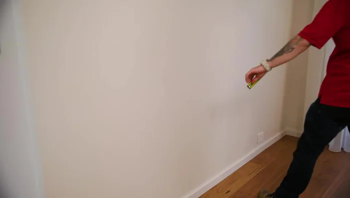 Prep the wall: Sand back any uneven surfaces and clean with sugar soap.