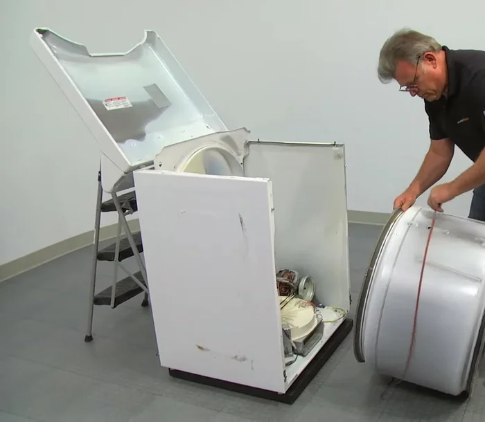 Check the belt placement by turning the drum at least one complete turn.