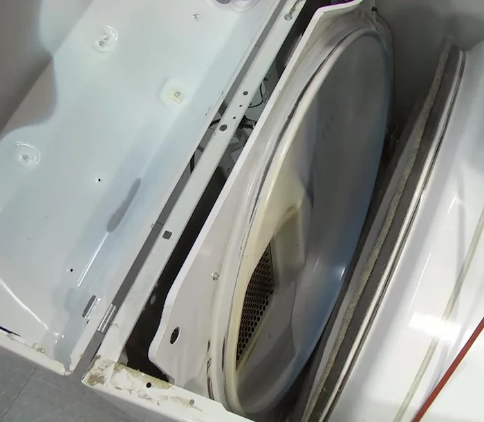 Check the belt placement by turning the drum at least one complete turn.