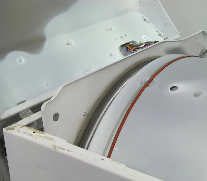 Check the belt placement by turning the drum at least one complete turn.