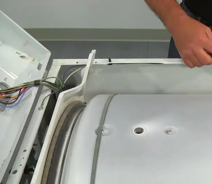 Remove the front panel by tilting it back and pulling it up from the mounting clips.