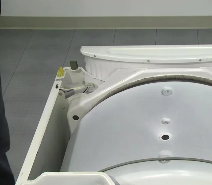 Remove the front panel by tilting it back and pulling it up from the mounting clips.