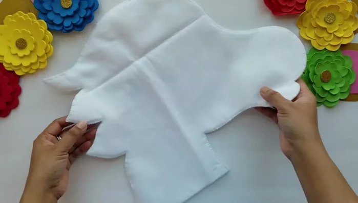 Stuff the felt unicorn face with cotton.