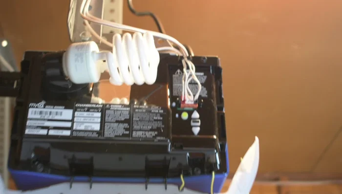 Plug in the garage door opener. Verify power by checking for green and amber lights on the sensors.