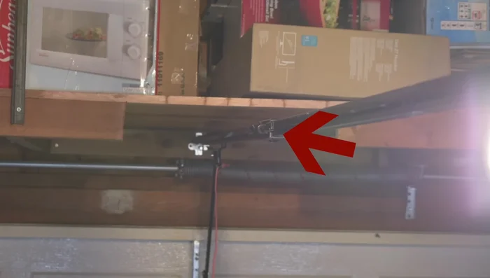 Press and hold the down button until the garage door reaches your desired opening point. Press the middle learn button again. The down arrow will blink orange/red.