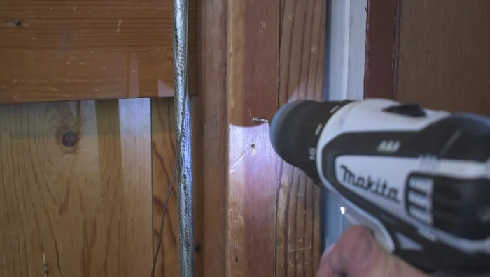 Drill pilot holes in the wall for mounting the garage door opener. Secure the opener to the wall using the provided bolts.
