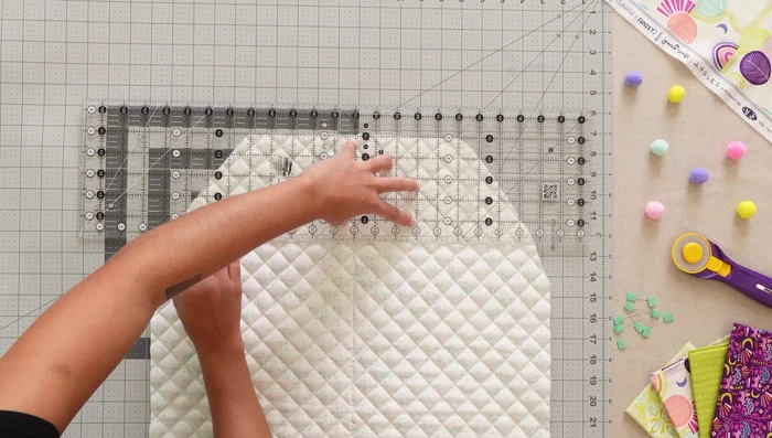 Attach pockets 1 and 2 to the organizer: Mark a line, place pockets, sew, and flip.