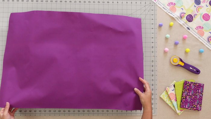 Layer backing, batting, and main fabric; quilt as desired.