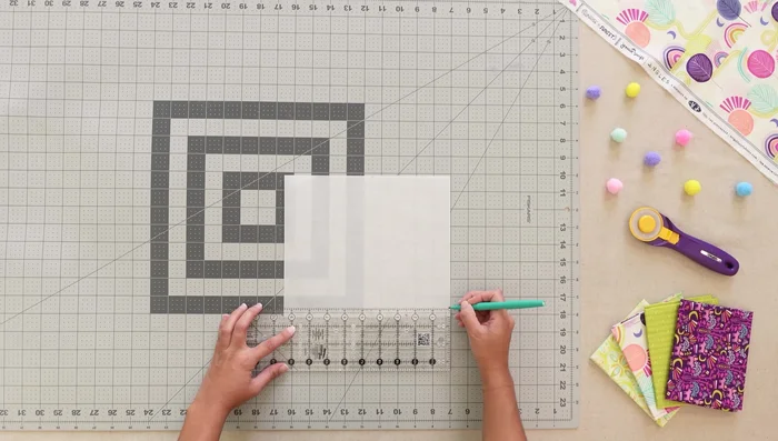 Create pocket patterns: Fold a 7x9 paper rectangle in half, mark points, and cut a smooth curve.