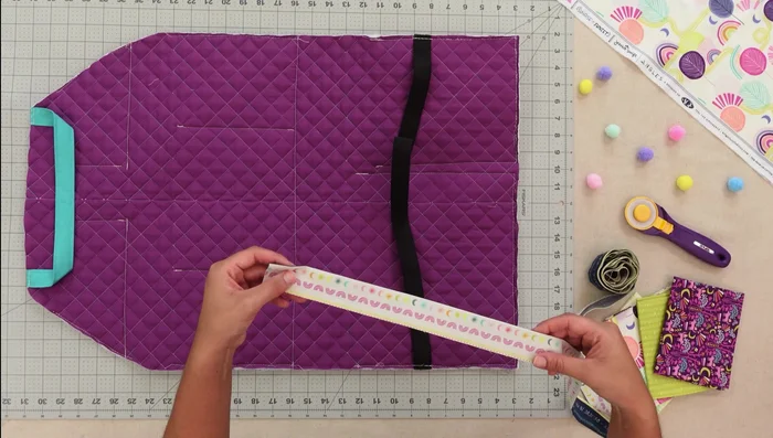 Attach binding: Use clips/pins to secure and stitch.
