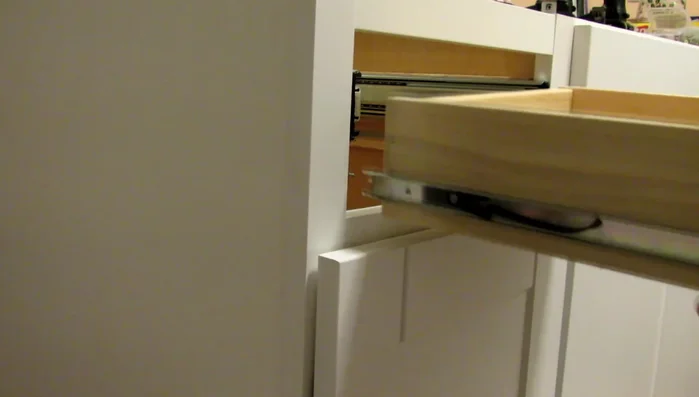 Reinstall the drawer, using the original drawer sides and the newly installed slides. The existing slides can be used to help position the new ones.