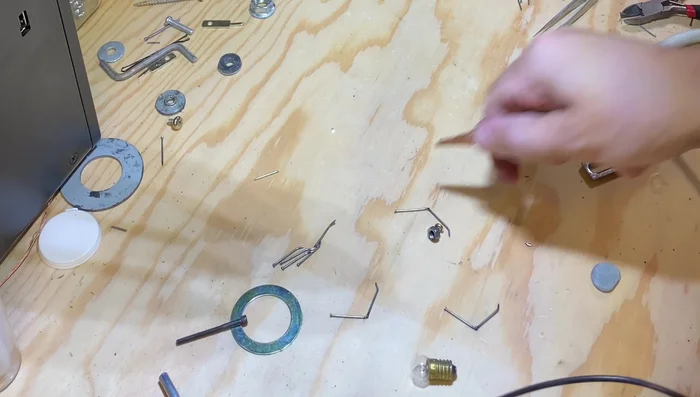 Lay out the legs in a spidery shape to check angles and symmetry before welding.