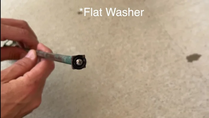 Remove the old flat washer using a screwdriver and/or utility knife. Try to preserve its size as a reference.