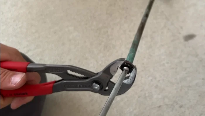 Remove the old flat washer using a screwdriver and/or utility knife. Try to preserve its size as a reference.