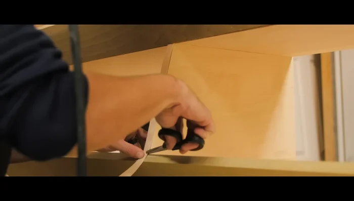 Spray several coats of wood ceiling primer and then several coats of exterior semi-gloss white paint.