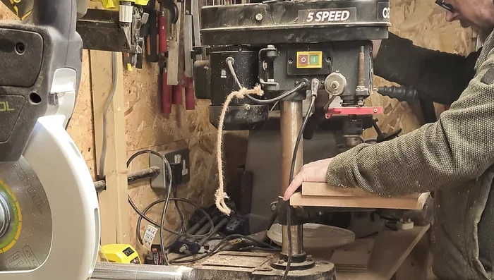 Cut the slot: Use a bandsaw (or hand saw/router) to cut a straight slot for the device.