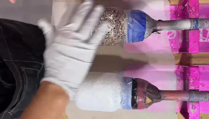 Apply epoxy coats: Apply 15ml of epoxy, pop bubbles, and let it spin for 2 hours. Then, apply another 10ml of epoxy and let it dry completely.