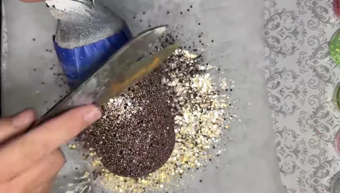 Flatten the chunky mix/fine glitter mix: Gently pat down the chunky/fine glitter mix with parchment paper to flatten the bits.