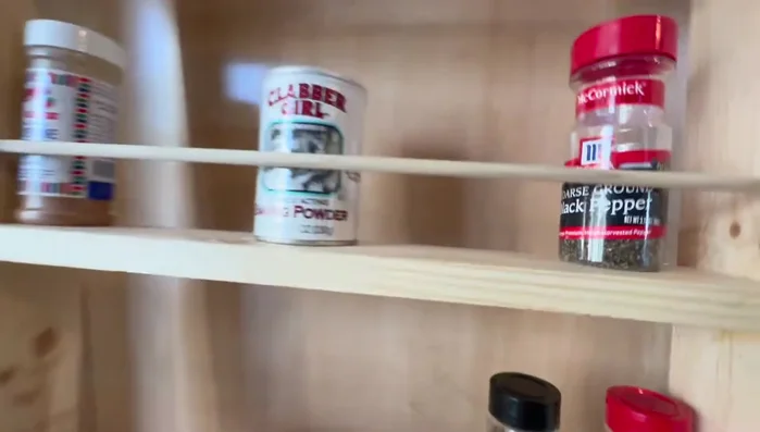 Add dowel pins and risers: Add dowel pins and risers to create adjustable shelves for various spice container sizes.