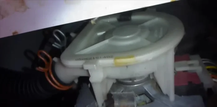 Remove the two metal clips securing the pump. Carefully remove the pump assembly.