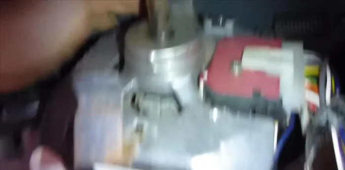 Remove the motor assembly; it's heavy, so be careful.