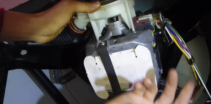 Reattach the pump assembly by securing it with the clips.