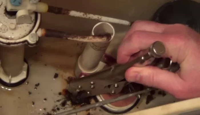 If bolts are stuck due to rust, use locking pliers to grip the bolt and try unscrewing the nut. If the bolt spins freely, use a hacksaw to carefully cut the bolt above the nut.