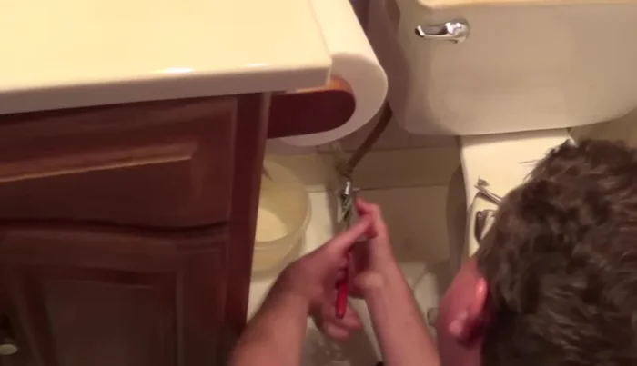 Use a sponge to remove any remaining water from the tank.