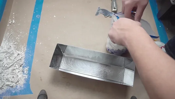 Apply a generous amount of joint compound to fill the hole created by the removed nail or screw, ensuring it is level with the surrounding wall surface.