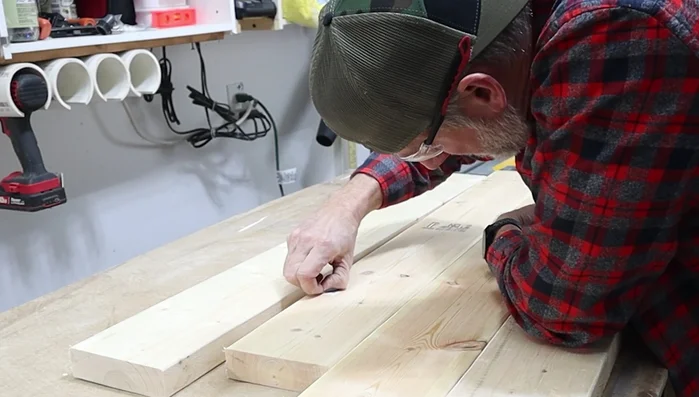 Cut biscuit slots using a biscuit jointer, following the marked lines.
