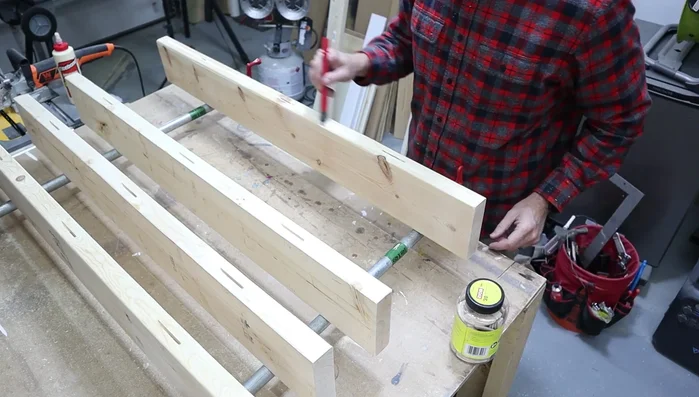 Clamp and secure the glued table top.