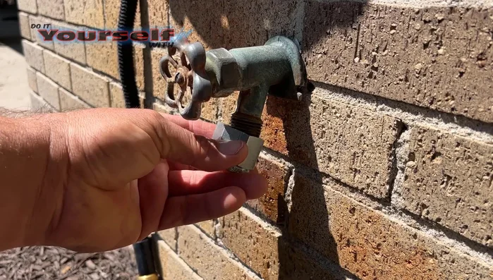 Screw the cleaner onto the hose bib by hand until it's tight.