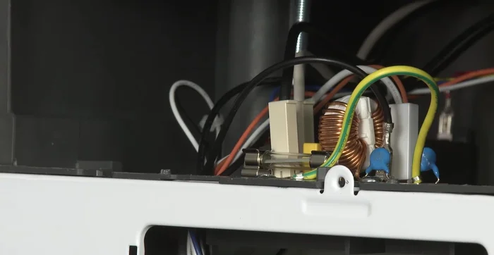 Realign the access grill and thread the screw back in.