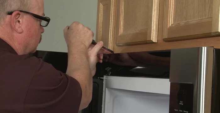 Use a putty knife (optional) to pry off the vent.