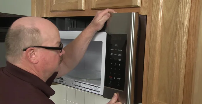 Remove the screw to release the access grill. Use a screwdriver to pry out the old fuse.