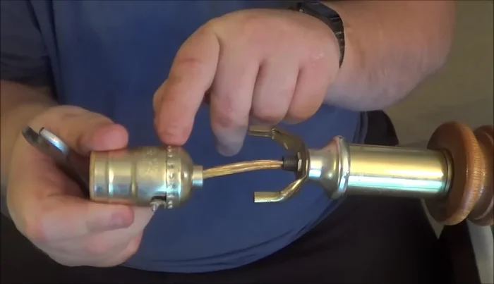 Disconnect the wires from the old socket. Note which wire (smooth or ridged) connects to which terminal (silver or copper).