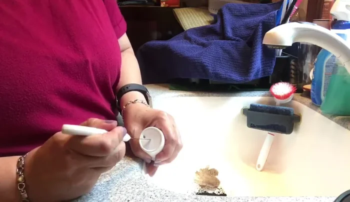 Carefully push the craft knife through the 'X' to create a hole for the lights.